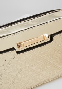 River Island Bandolera - gold-coloured