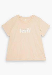 Svetle broskvová tričko s krátkým rukávem vyrobené z bavlny, s bílým logem "levi's" na přední straně a rovný lem se malou červenou nášivkou.