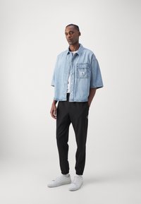 Calvin Klein Jeans TECHNICAL BADGE PANT - Joggebukse - black