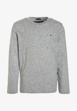 Lysegrå langærmet bomuldsskjorte med rund hals og lille Tommy Hilfiger-logo på venstre side af brystet.