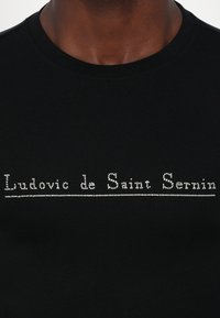 Ludovic de Saint Sernin SIMPLE LONG SLEEVES STUD LOGO UNISEX - Hosszú ujjú felső - black