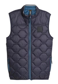 Marineblauwe, gewatteerde vest met een hoge kraag, voorzien van een volledige ritssluiting en twee zijzakken. Accentueert met blauwe ritsen en een logo patch.