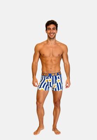 Heren boxer briefs met een blauw gestreept patroon en gele eiergraphics. Elastische tailleband met "MR UKKO" branding, rekbare stof.