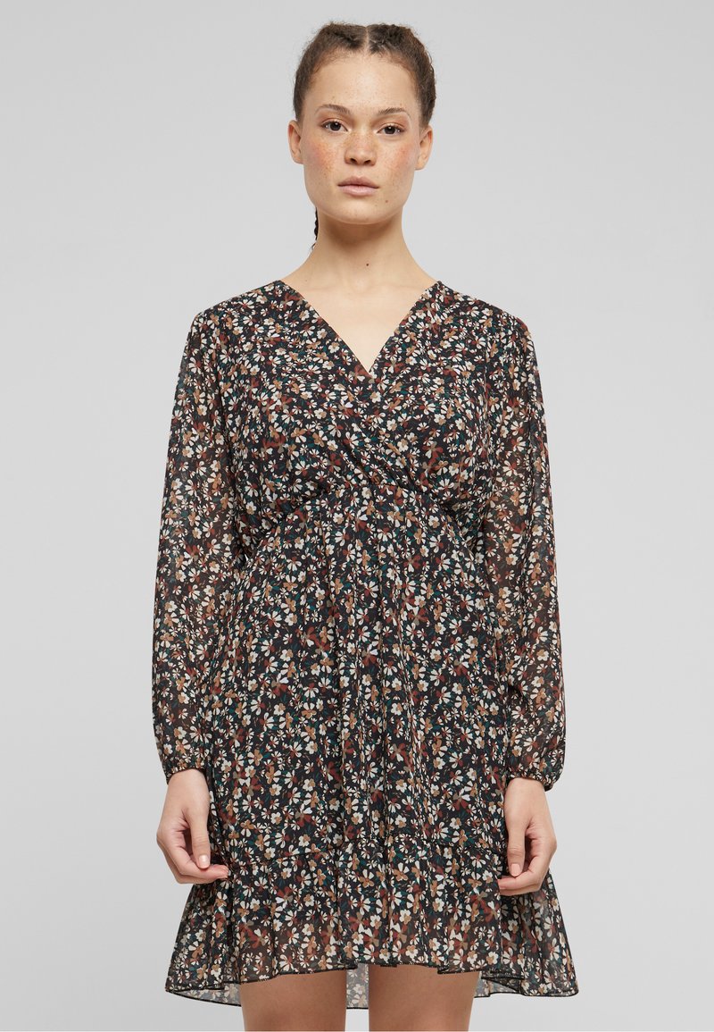 Black floral dress with long sleeves, V-neck, and gathered waistline. Features multi-colored small floral print and sheer, lightweight fabric.