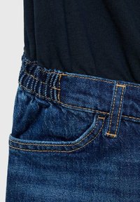 Denim jeans with an elastic waistband. Features include deep blue color, orange stitching, a front pocket, and smooth texture.