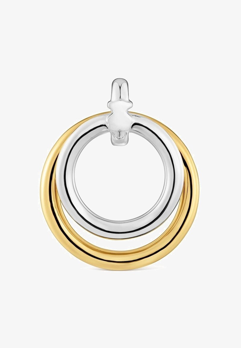 Srebrno-złote kolczyki koła nakładające się na siebie, z mniejszym srebrnym kółkiem wewnątrz większego złotego oraz srebrnym zapięciem na górze.