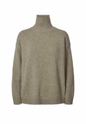 Beżowy golf wykonany z miękkiego dzianinowego materiału. Posiada prążkowany kołnierz i mankiety oraz luźny, swobodny krój.