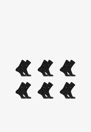 Six paires de chaussettes noires mi-mollet disposées en deux rangées sur un fond blanc, chaque paire présentée côte à côte avec un logo près de la cheville.