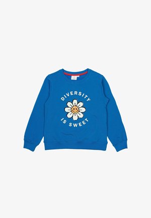 Sudadera azul de mangas largas, con un gráfico de margarita blanca y el texto "LA DIVERSIDAD ES DULCE" en letras blancas. Puños y cuello acanalados.