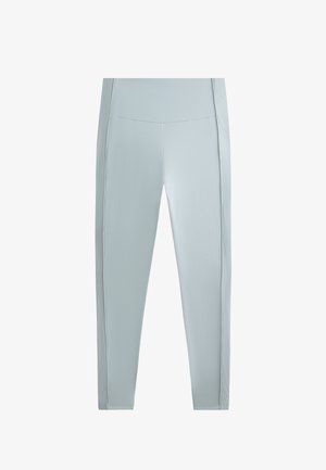 Svetlo modre, raztegljive legice z visokim pasom. Imajo teksturirane stranske panele za dodaten detajl. Gladka tkanina z oprijetim designom.