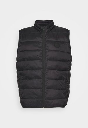 Veste sans manches matelassée noire avec fermeture éclair à l'avant et col montant, avec des coutures horizontales subtiles et deux poches latérales zippées.