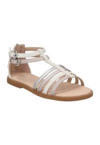 Sandalias planas blancas y plateadas con tiras, que presentan correas con hebilla en los tobillos y un forro interior perforado para mayor transpirabilidad.