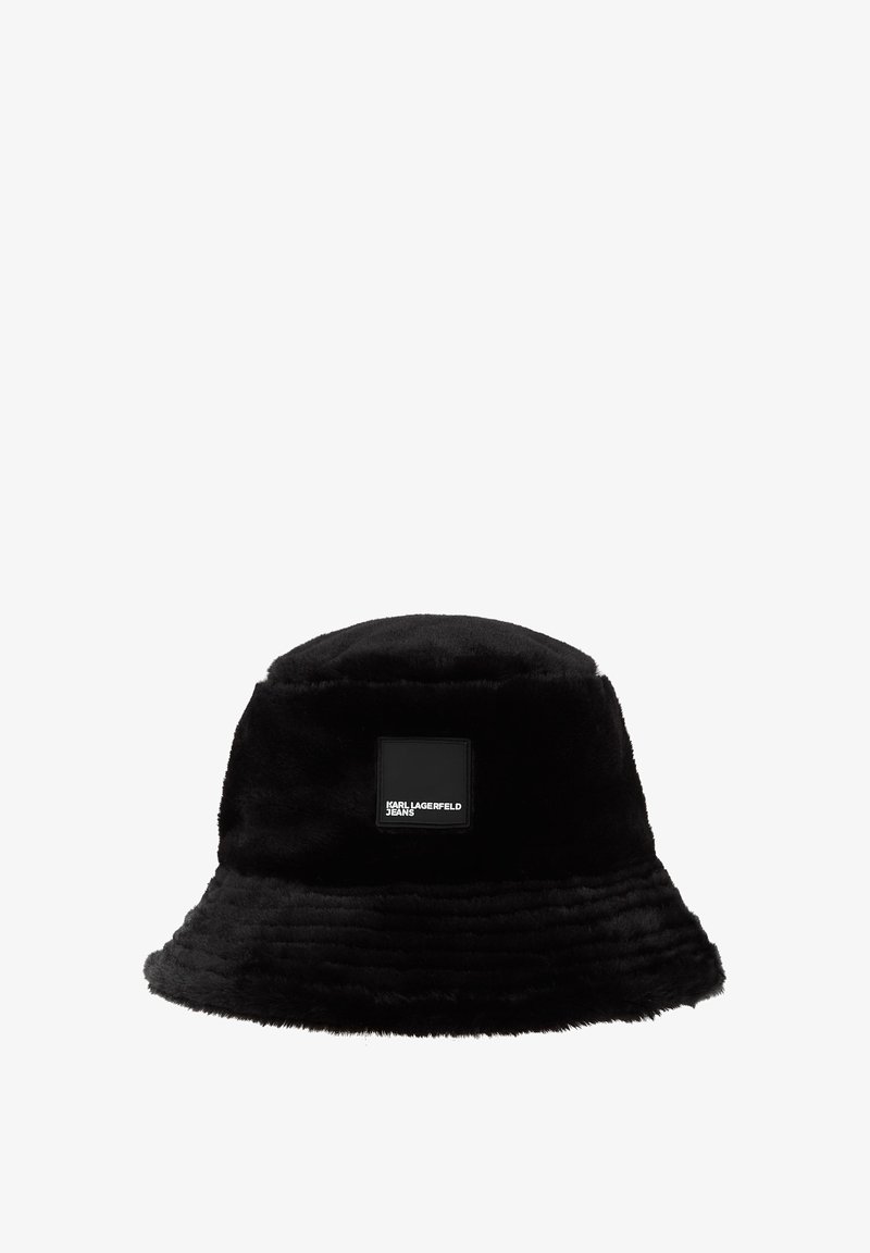 Black bucket hat made of soft faux fur, featuring a wide brim and a square black patch with white text reading "KARL LAGERFELD JEANS."