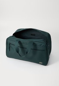 Lacoste ROLL BAG UNISEX - Ranac - sinople
