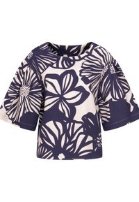 Top con stampa floreale caratterizzato da maniche corte e larghe; sfondo blu scuro con grandi motivi floreali bianchi; scollatura rotonda; texture del tessuto liscia.