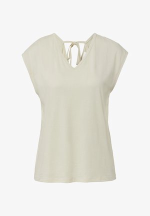 Kremowy, bezrękawnik z dekoltem w kształcie litery V oraz związaną kokardką na plecach.