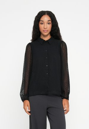 Black blouse with a collared neckline, button-down front, and sheer puffed sleeves. Fabric features a subtle dotted texture.