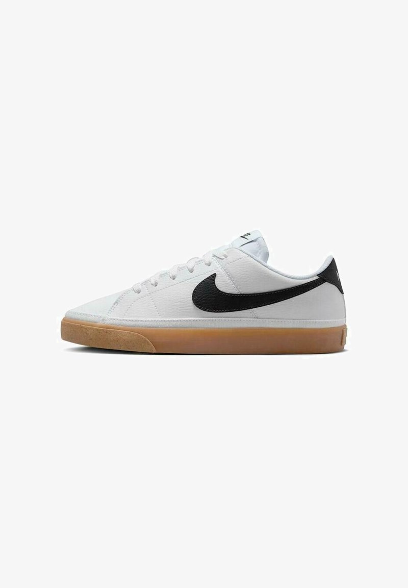 White low-top sneaker with black Nike swoosh and gum rubber sole, shown from the side on a white background.