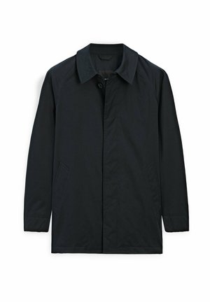 Veste noire avec un col classique, fermeture à boutons, deux poches latérales et une texture lisse et mate. Le design est épuré et minimal.
