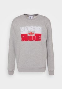 Grå sweatshirt i bomullsblandning, med en röd och vit "SPORTS CLUB" grafik med Adidas-logotyp i mitten. Ribbad mudd och nederkant.