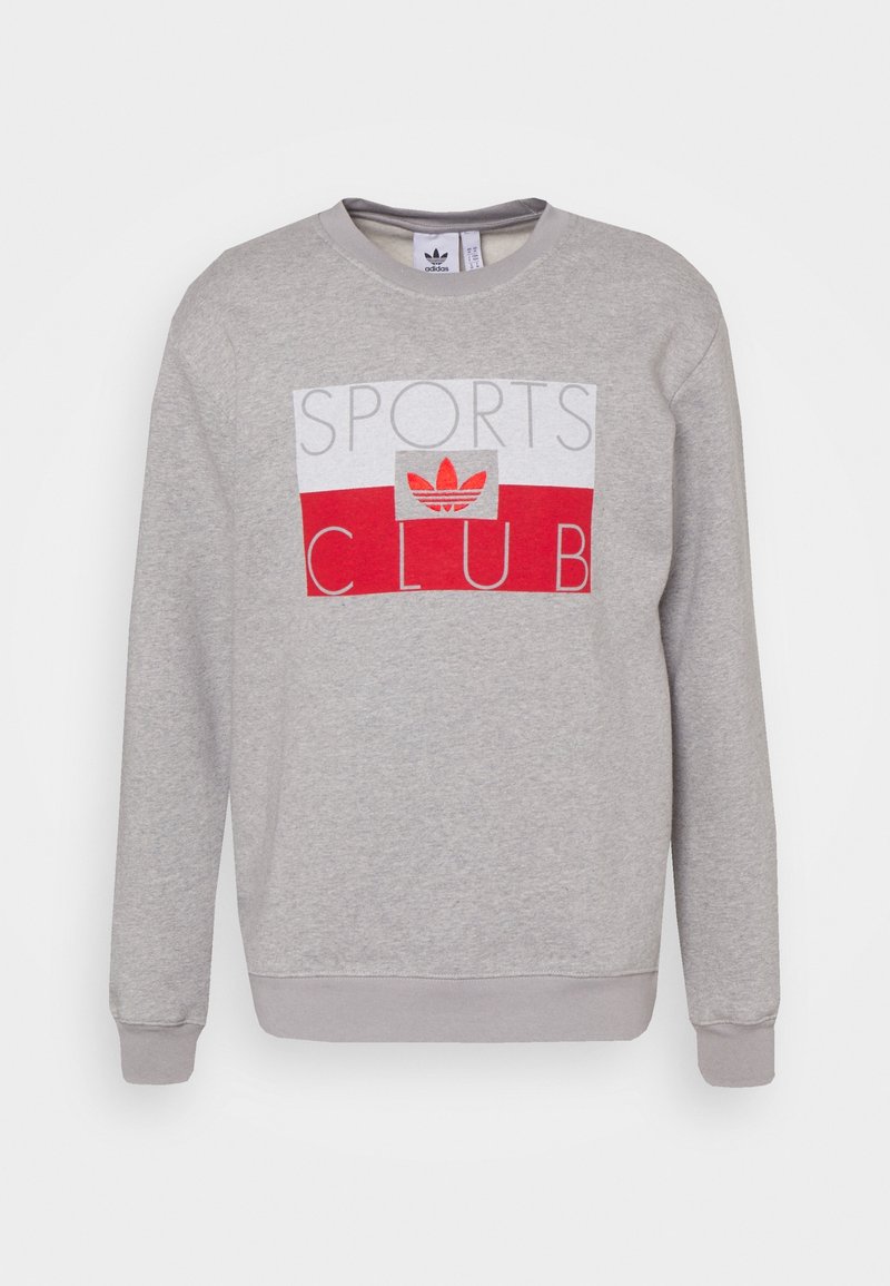 Grå sweatshirt i bomullsblandning, med en röd och vit "SPORTS CLUB" grafik med Adidas-logotyp i mitten. Ribbad mudd och nederkant.