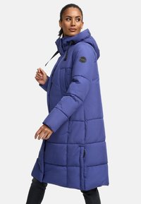Padded purple coat with a hood, featuring a quilted design, black accents, and side pockets. It has a straight cut and mid-thigh length.