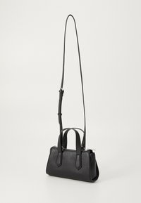 Black leather handbag with a textured finish, dual top handles, and a detachable shoulder strap; features a zippered closure and angular accents.