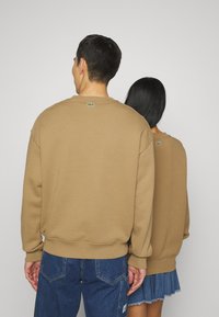 Lacoste CROC UNISEX - Sportska majica - marron