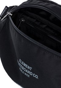 Black fabric pouch with a zippered opening, features an interior pocket, logo text, and sleek, smooth texture.