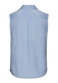 Light blue sleeveless shirt in a linen blend. Features a collar, back yoke, and a streamlined shape with a slightly curved hem.
