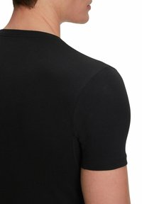 FALKE Daily Climate Control Outlast® Round Neck - Undershirt - black