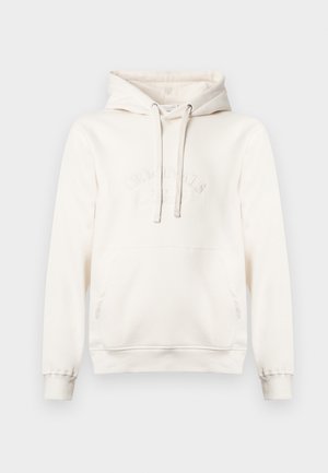 Light beige hoodie made of soft fabric, featuring a front pocket, adjustable drawstrings, and embossed text detailing on the chest.