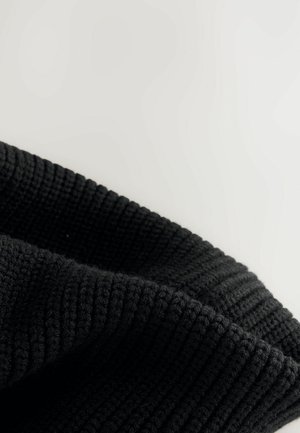 Black knitted scarf with a textured, ribbed pattern and folded edge, showcasing a smooth, soft finish and uniform color throughout.
