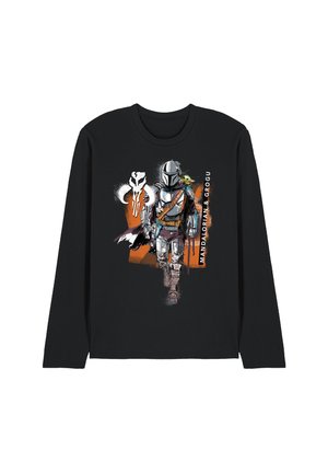 Black long-sleeve shirt with graphic of Mandalorian in armor walking, Grogu on shoulder, and Mando skull symbol with orange background.