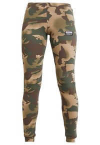 Maskovací legíny v odstínech zelené, hnědé a béžové. Vyrobené z elastické látky s přiléhavým střihem a s logem Adidas.