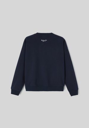Sweat-shirt en coton bleu marine à manches longues, avec poignets et ceinture côtelés. Présente la broderie « Back in the game » au niveau de la nuque à l'arrière.