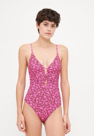Maillot de bain une pièce à imprimé floral rose avec un décolleté en V profond, des fines bretelles, un détail en trou de serrure à l'avant et des jambes très échancrées, fabriqué en tissu extensible.