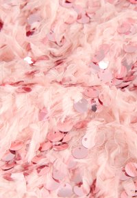 Pink feathery fabric with circular, reflective sequins scattered throughout. The texture is soft, with a mix of matte and shiny finishes.