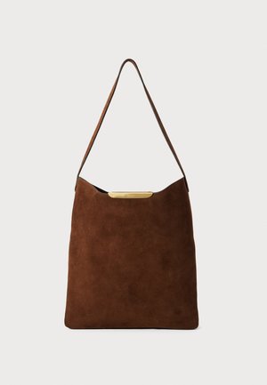 Brown suede shoulder bag featuring a curved top, a single strap, and a gold-tone hardware accent on the front. Simple, minimal design.