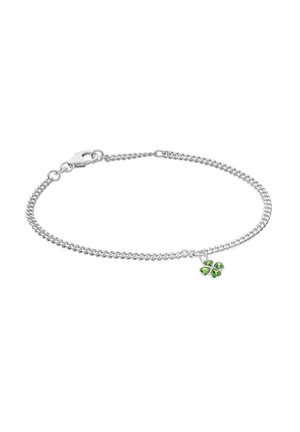 Silver chain bracelet with small green four-leaf clover charm and lobster clasp on white background.