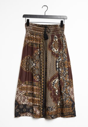 Brown patterned midi skirt with elastic waistband and black tassel tie, featuring symmetrical geometric and floral designs.