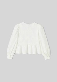 Blouse blanche à manches longues avec broderie florale, encolure ronde et bas à volant. Manches froncées et poignets à boutons. Tissu texturé.