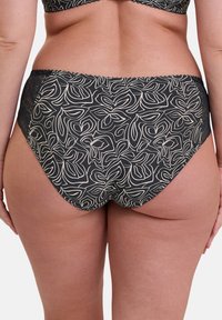 Dessous noirs avec un motif floral blanc, présentant une finition en dentelle sur les bords et un design taille haute. Texture lisse avec un tissu doux.