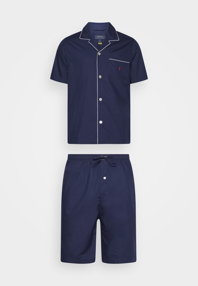 Navy blue cotton pajama set featuring a short-sleeve button-up shirt with white piping and matching shorts with an elastic waistband and drawstring.