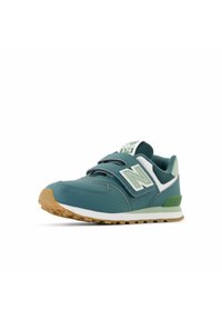 Zapatillas deportivas en tonos verde azulado y verde claro con un upper texturizado, diseño sin cordones y una suela de goma. Cuentan con un logo prominente en el lateral.