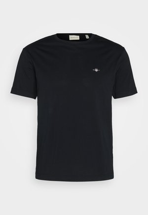 Zwarte katoenen t-shirt met een ronde hals, korte mouwen en een klein logo op de borst. Glad materiaal, standaard pasvorm en geen zichtbare patronen.