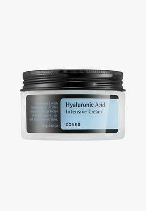 Barattolo di COSRX Hyaluronic Acid Intensive Cream con coperchio nero, crema idratante etichettata per nutrire e idratare in profondità la pelle, formato 100g.