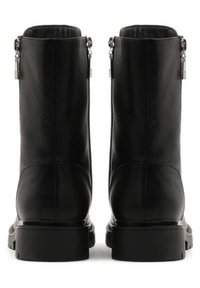 Black leather ankle boots with a smooth texture, rounded toe, and chunky sole. Features silver zipper accents on both sides.