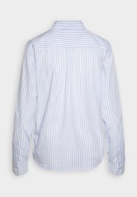 Light blue and white striped long-sleeve shirt with a pointed collar, back yoke detail, buttoned cuffs, and a curved hem.
