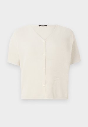 Lühikeste varrukatega nööpiga kardigan kreemjas värvitoonis, millel on V-kaelus ja tekstuurne, kerge kudum. Siledad nupud ees.